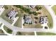 Aerial view of upscale homes with lush landscaping, large lots, and a planned community layout at 313 Masters Club Blvd, Hampton, GA 30228