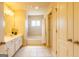 Bathroom with large vanity, tiled bathtub and shower at 313 Masters Club Blvd, Hampton, GA 30228