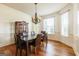 Formal dining room with hardwood floors, chandelier lighting, and decorative molding at 313 Masters Club Blvd, Hampton, GA 30228
