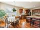Eat-in kitchen featuring granite countertops, a central island, and dark wood cabinetry at 313 Masters Club Blvd, Hampton, GA 30228