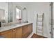 Bathroom with double vanity, modern fixtures, and a walk-in shower; stylish and functional at 145 Kelmscott Ln, Fayetteville, GA 30214