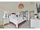 Cozy bedroom with a rustic-style bed, ample natural light, and soothing neutral tones at 145 Kelmscott Ln, Fayetteville, GA 30214