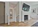 Hallway with a modern fireplace, staircase, and sleek design, enhancing the home's appeal at 145 Kelmscott Ln, Fayetteville, GA 30214