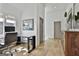 Cozy home office featuring a glass desk, modern decor, and plenty of natural light at 145 Kelmscott Ln, Fayetteville, GA 30214