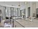 Spacious kitchen with marble countertops, stainless steel appliances, and open dining area at 145 Kelmscott Ln, Fayetteville, GA 30214
