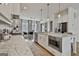Modern kitchen with white cabinets, stainless steel appliances, and a marble countertop island at 145 Kelmscott Ln, Fayetteville, GA 30214