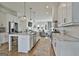 Bright, open kitchen with large island, marble countertops, stainless appliances, and easy flow to living spaces at 145 Kelmscott Ln, Fayetteville, GA 30214