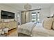 Comfortable bedroom featuring a light-colored bed, and a large television at 145 Kelmscott Ln, Fayetteville, GA 30214