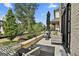 Relaxing outdoor patio features comfortable seating, stylish decor, and a scenic view of the community's green space at 145 Kelmscott Ln, Fayetteville, GA 30214