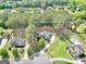 Aerial view highlighting the property's boundaries, mature trees, and proximity to neighborhood amenities at 204 Carmell Ct, Mcdonough, GA 30252