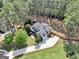 Expansive aerial view of estate home on large lot with mature trees, long driveway, and fenced backyard at 204 Carmell Ct, Mcdonough, GA 30252