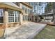 Beautiful backyard with a stone patio, gazebo, and expansive lawn surrounded by trees at 204 Carmell Ct, Mcdonough, GA 30252