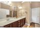 Bathroom featuring a double vanity, a large mirror and separate shower at 204 Carmell Ct, Mcdonough, GA 30252