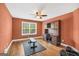 Large exercise room featuring a ceiling fan and desk at 204 Carmell Ct, Mcdonough, GA 30252