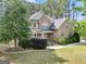 Attractive two-story home featuring brick and siding, landscaping, and a welcoming entrance at 204 Carmell Ct, Mcdonough, GA 30252
