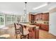 Eat-in kitchen with granite countertops and wood cabinets at 204 Carmell Ct, Mcdonough, GA 30252