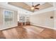 Bright living room with hardwood floors, a ceiling fan, and many windows at 204 Carmell Ct, Mcdonough, GA 30252