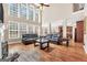 Open-concept living room with high ceilings and many windows at 204 Carmell Ct, Mcdonough, GA 30252