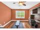 Office space with ceiling fan, hardwood floors, natural light and built-in desk at 204 Carmell Ct, Mcdonough, GA 30252
