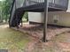 Backyard view featuring a deck with stairs, pine straw ground cover, and siding at 140 Clover Valley Dr, Covington, GA 30016