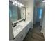 Bright bathroom with double vanity, modern fixtures, and tiled floors at 140 Clover Valley Dr, Covington, GA 30016