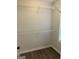 Walk in closet featuring wire shelving and hardwood floors at 140 Clover Valley Dr, Covington, GA 30016