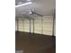 This is a spacious two-car garage with overhead lighting and plenty of space at 140 Clover Valley Dr, Covington, GA 30016