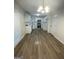 Bright kitchen with modern appliances, white cabinets, and hardwood floors at 140 Clover Valley Dr, Covington, GA 30016
