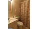 Well-maintained bathroom with a toilet, sink, vanity, and shower-tub combination at 1320 Labelle St, Jonesboro, GA 30238