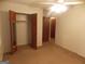 Spacious bedroom boasts a closet with full length mirror doors and ceiling fan at 1320 Labelle St, Jonesboro, GA 30238