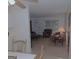 Open concept living room with eat in kitchen featuring warm, natural light and cozy furnishings at 1320 Labelle St, Jonesboro, GA 30238