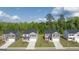 An aerial shot of modern houses lined up neatly, showcasing their facades, driveways, and landscaped lawns at 604 Whitman Ln # 27, Stockbridge, GA 30281