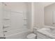 Bathroom featuring white tub and shower combo, vanity with marble-look countertop and chrome faucet at 604 Whitman Ln # 27, Stockbridge, GA 30281