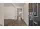 Inviting entryway featuring wood flooring, neutral walls, and an open view into the home's interior at 604 Whitman Ln # 27, Stockbridge, GA 30281