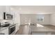 Modern kitchen features stainless steel appliances, granite countertops, and a large island with a double sink at 604 Whitman Ln # 27, Stockbridge, GA 30281