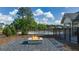Community pool area with a fire pit and surrounded by greenery at 604 Whitman Ln # 27, Stockbridge, GA 30281