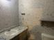 Bathroom features a vanity with granite countertop and stylish wall texture at 3255 Flat Shoals Sw Rd, Conyers, GA 30094