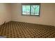 Bedroom with patterned carpet and views of the wooded area at 3255 Flat Shoals Sw Rd, Conyers, GA 30094