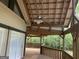 Covered outdoor patio and fan, perfect for enjoying the outdoors and private wooded views at 3255 Flat Shoals Sw Rd, Conyers, GA 30094