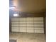 Residential garage with plenty of space and a newer garage door at 3255 Flat Shoals Sw Rd, Conyers, GA 30094