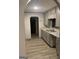 Stylish kitchen features granite countertops, stainless steel sink, and ample cabinet space at 3255 Flat Shoals Sw Rd, Conyers, GA 30094