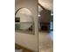 Living room featuring a fish tank, decorative arch, and a red brick fireplace at 3255 Flat Shoals Sw Rd, Conyers, GA 30094