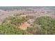 An elevated scenic view of the house with pool surrounded by lush, dense forestry at 203 Shelby Ln, Fayetteville, GA 30215