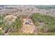 An aerial view of the home and property surrounded by tall trees, showcasing the peaceful seclusion at 203 Shelby Ln, Fayetteville, GA 30215