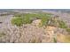 Aerial view showcasing the home with a pool and the extensive woods surrounding the property at 203 Shelby Ln, Fayetteville, GA 30215