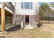 Basement entrance with stone accents and landscaped surroundings at 203 Shelby Ln, Fayetteville, GA 30215