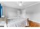 A bright bedroom with hardwood floors, white trim, and two closets, offering space and functionality at 203 Shelby Ln, Fayetteville, GA 30215
