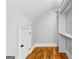 Spacious closet featuring custom shelving, hardwood floors, and ample storage space at 203 Shelby Ln, Fayetteville, GA 30215