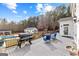 Outdoor deck featuring grill, seating, and picturesque backyard views at 203 Shelby Ln, Fayetteville, GA 30215