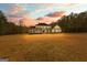Charming two-story home with a spacious front yard and classic architectural details at 203 Shelby Ln, Fayetteville, GA 30215